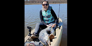 Lindsey Straiton may need a larger kayak if she keeps catching blue catfish this large. Photo courtesy of Lindsey Straiton