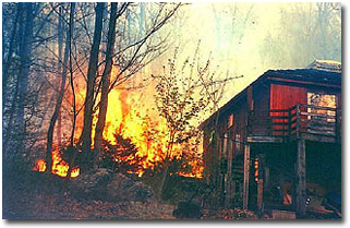 Wildland fire close to a house
