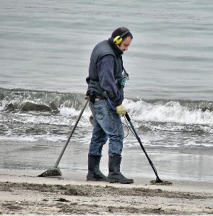 Park visitor using metal detector